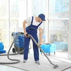 Man cleaning Carpet Man Cleaning Carpet